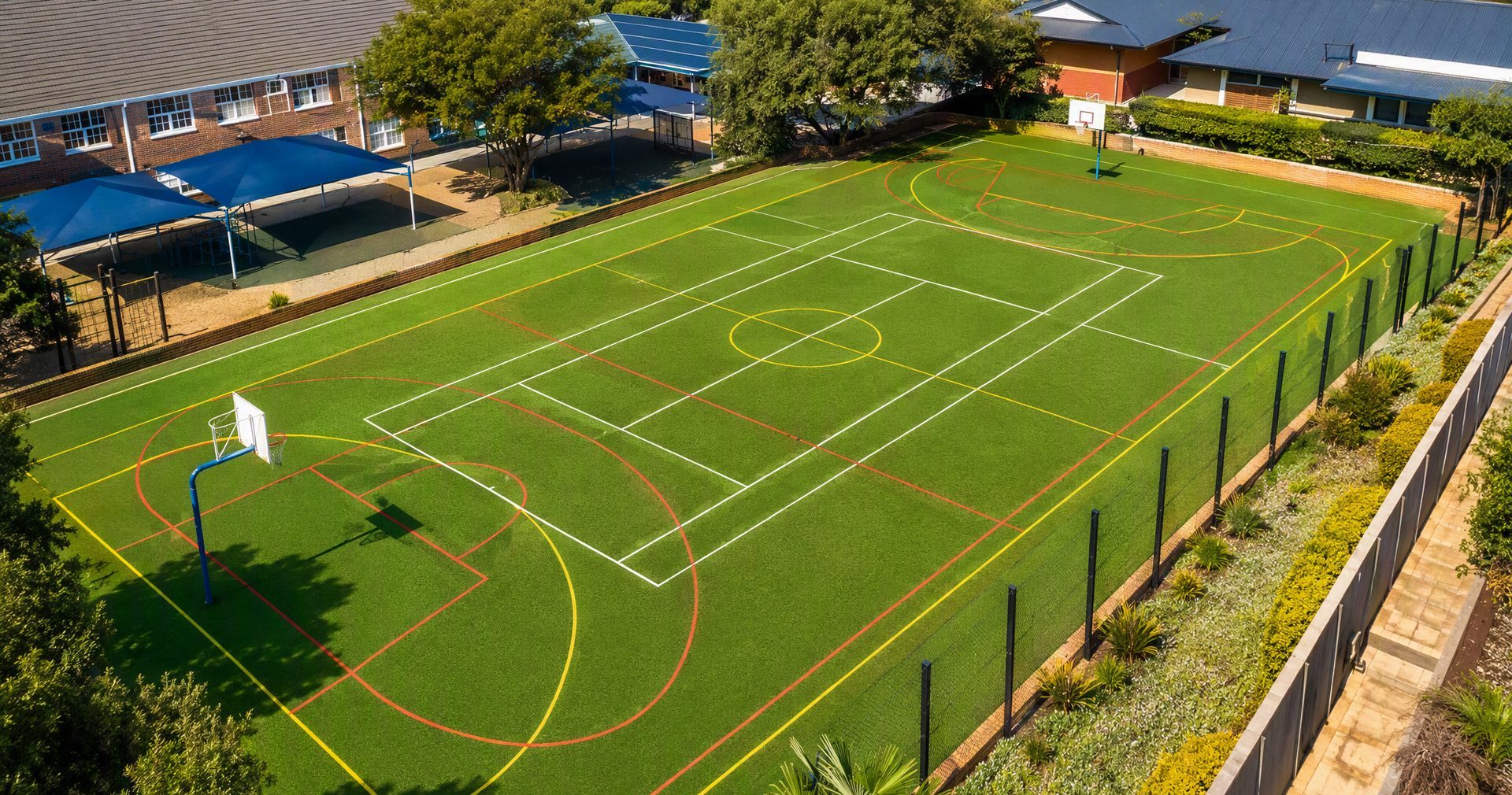 Multi-sport artificial turf court with netball and basketball lines